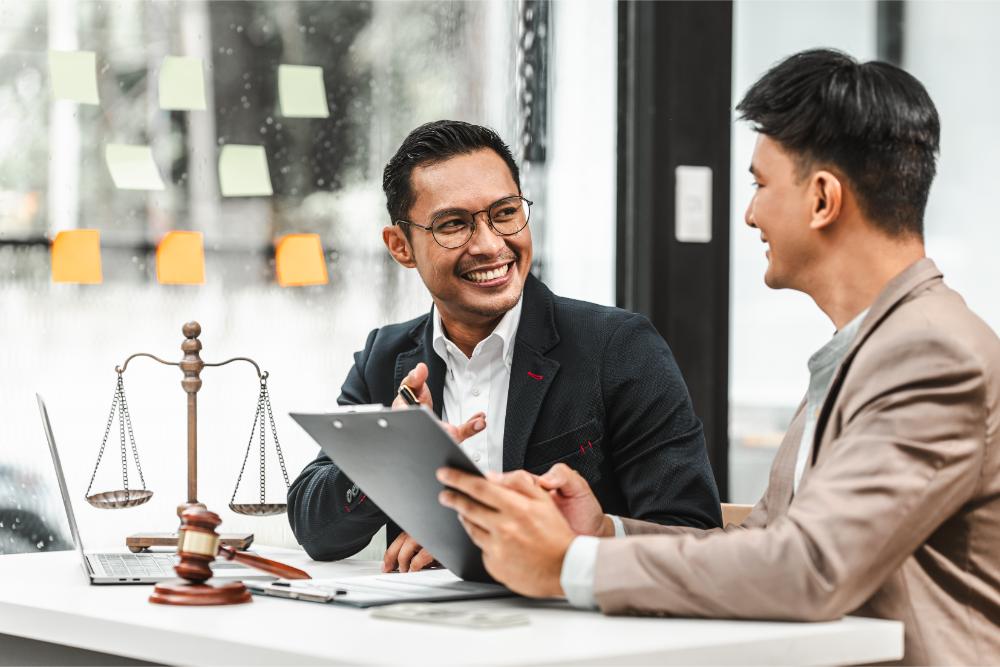 two-disgusting-businessmen-asian-lawyer-of-indian-DXFP96J.jpg