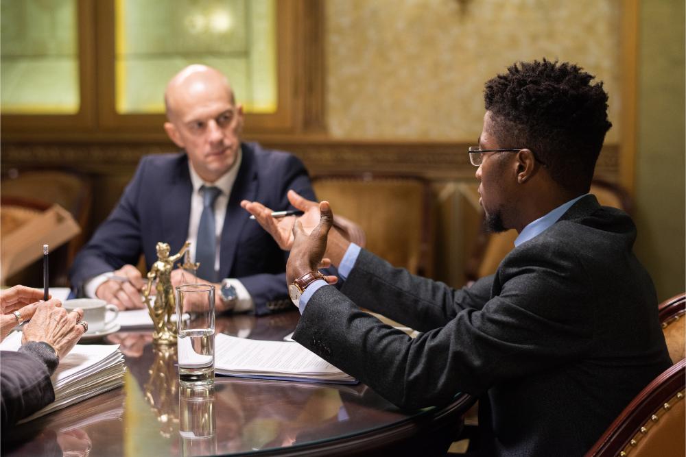 young-african-businessman-explaining-his-viewpoint-2GBQXM5.jpg